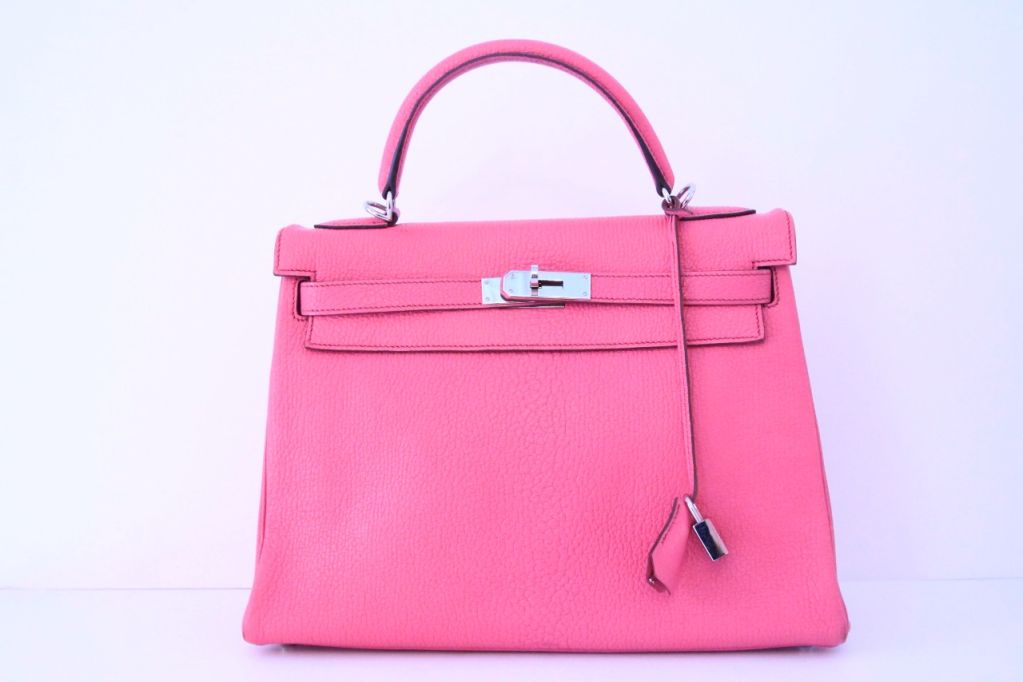 A timeless classic in a fun a flirty color!<br />
<br />
Made in the most luxurious Chevre leather with palladium hardware. <br />
<br />
Top handle with front flap and twist lock closure.<br />
<br />
Accompanied by shoulder strap, lock,