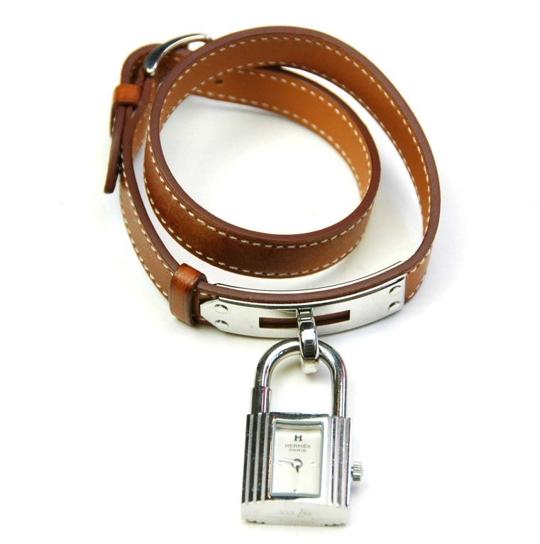 Hermes Lady's Stainless Steel Kelly Wrap Band Wristwatch
Age: 2010
Swiss Made
Materials: Stainless Steel with Brown Leather
Stamped: HERMES PARIS SWISS MADE
Blind Stamp Reads: N

Wrist Size: 5.5