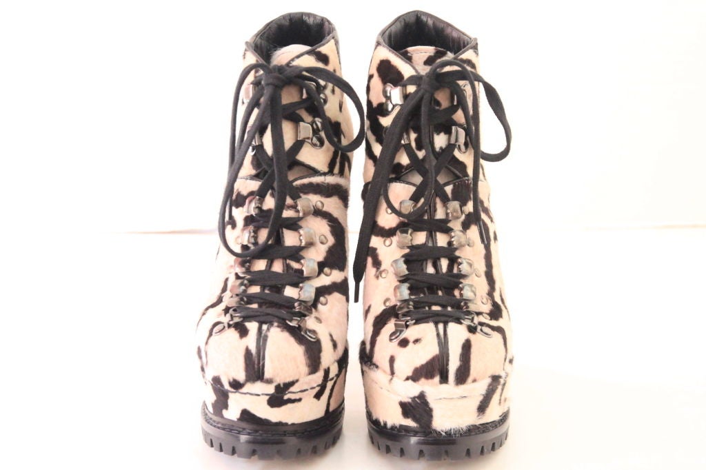 These ALAIA Snow Leopard Ponyhair Platform Hiking Boots are extremely desirable, and they are loved by many celebrities. <br />
Featurs a covered platform sole and stiletto heel. Black leather trim at ankle and lace up fastening with hardware
