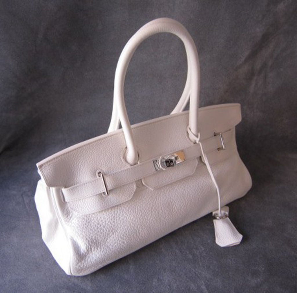 This Hermes JPG (Jean Paul Gaultier) model Birkin is the 42cm, and it is the timeless classic and a celebrity favorite. A must-have addition to any Hermes lover's collection!<br />
<br />
Features white togo leather with palladium hardware. The