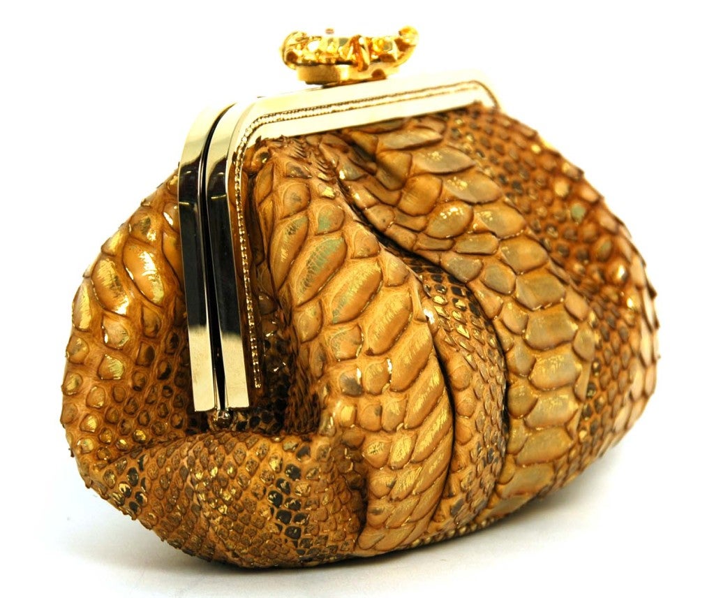 Judith Leiber Tan Python Clutch With Stone Closure And Goldtone Chain
Materials: Python, Goldtone Hardware
Interior Slip Pocket
Stamped: 