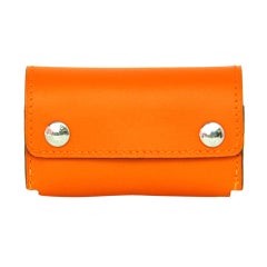 HERMES "In The Pocket" Dominos In Orange Leather Case RT $445