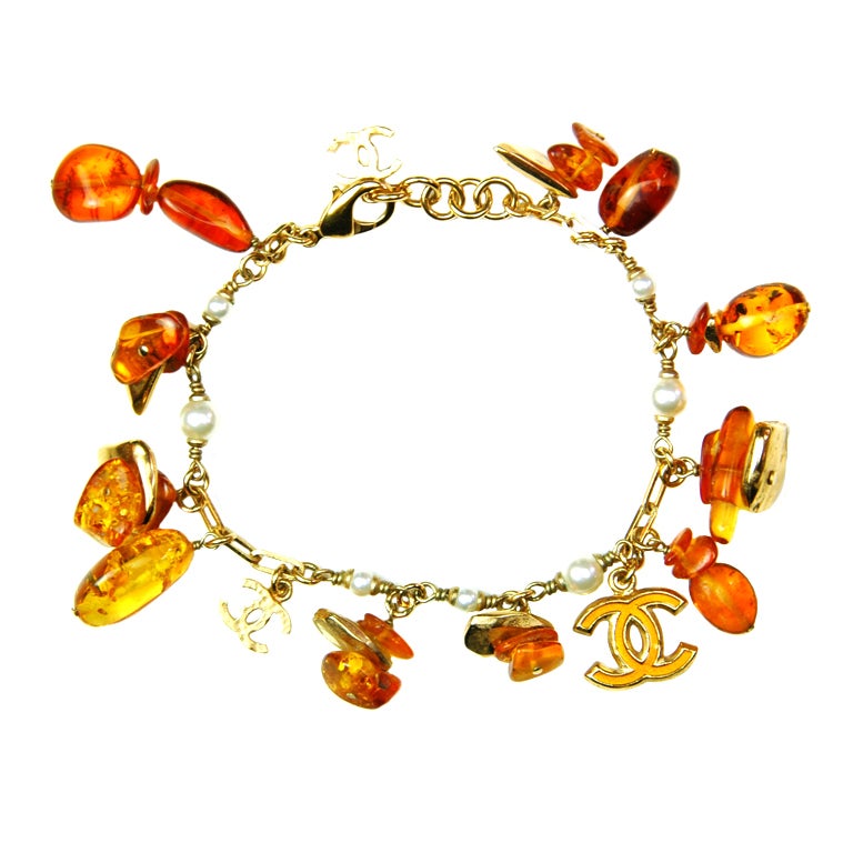 CHANEL Gold Tone Charm Bracelet With Dangling Amber Clusters at 1stdibs
