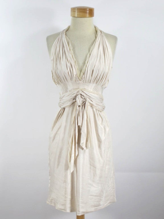 Cream silk dress with waist sash.