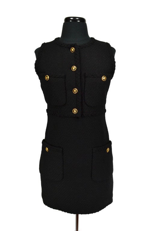 Chanel black wool tweed sleeveless dress with gold buttons. Year: 1960's