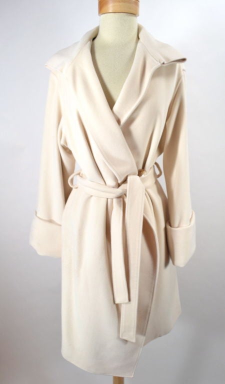 Ivory cashmere cuffed coat with black lining.