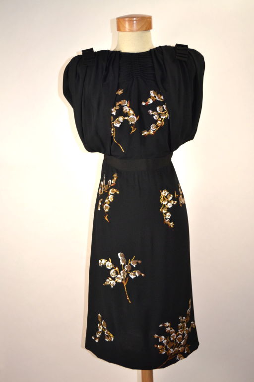 Beautiful Miu Miu black dress with gold and white floral detail. Current Season