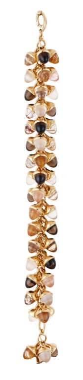 Fabulously heavy and luxurious, Tamara Comolli's iconic Mikado Flamenco bracelet in her famously chic and moody Cinnamon colours - Smokey quartz, rutilated quartz and moonstone Mikado 8mm acorns captured in 18ct pink gold