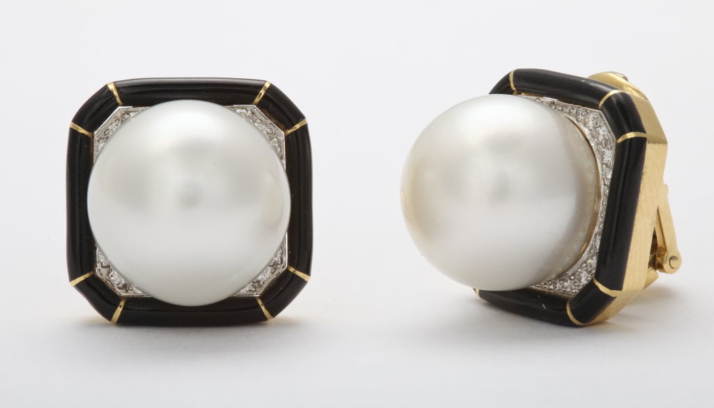 A pair of large enamel and diamond pearl earrings by David Webb. Circa 1980's. Set on 18k gold and Platinum.