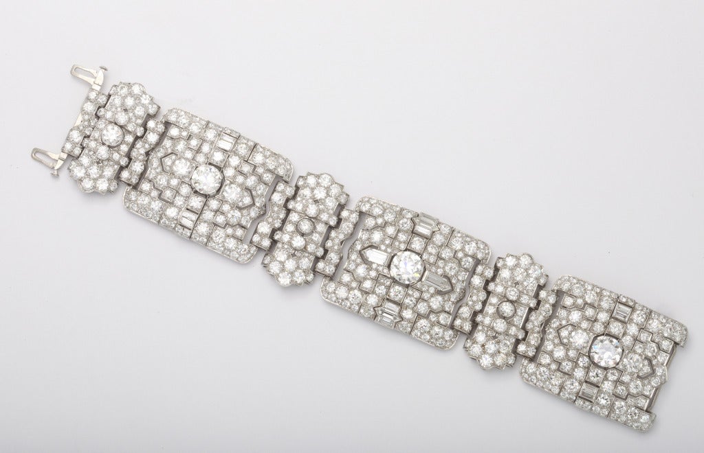 A superb Art Deco wide platinum and diamond flexible bracelet. Consisting of approximately  62.35 carats of Old European mine cut, bullet shape cut, and baguette cut diamonds. F- G color diamonds. VVS1- VS1 quality.  Mounted on Platinum, Circa