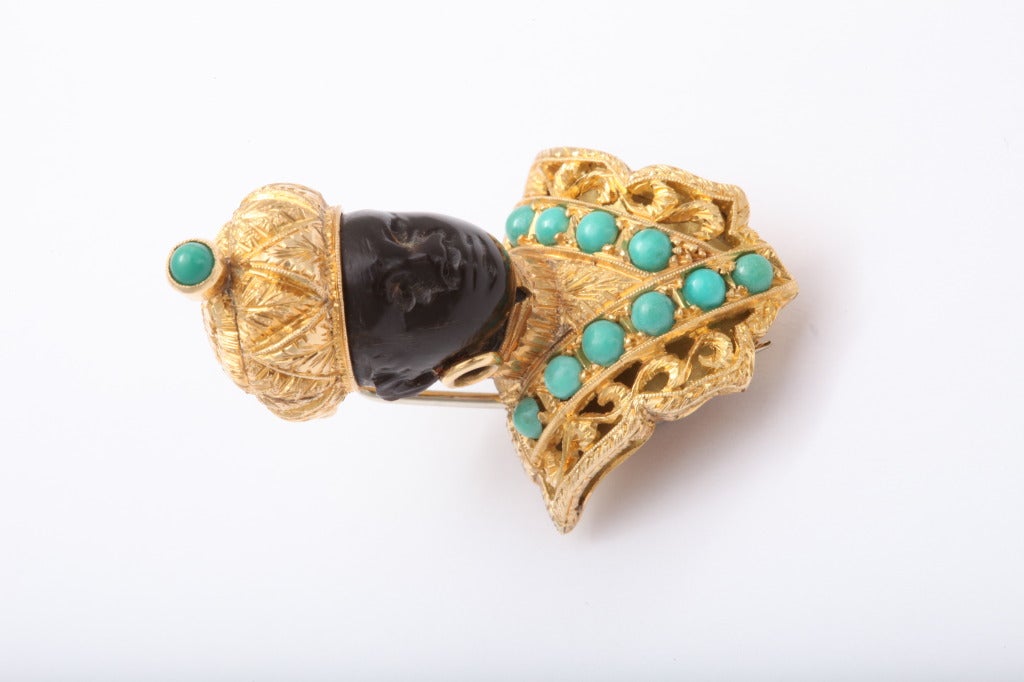 A fine pendant brooch consisting round Persian turquoise set on 18k gold. Signed Nardi 750.