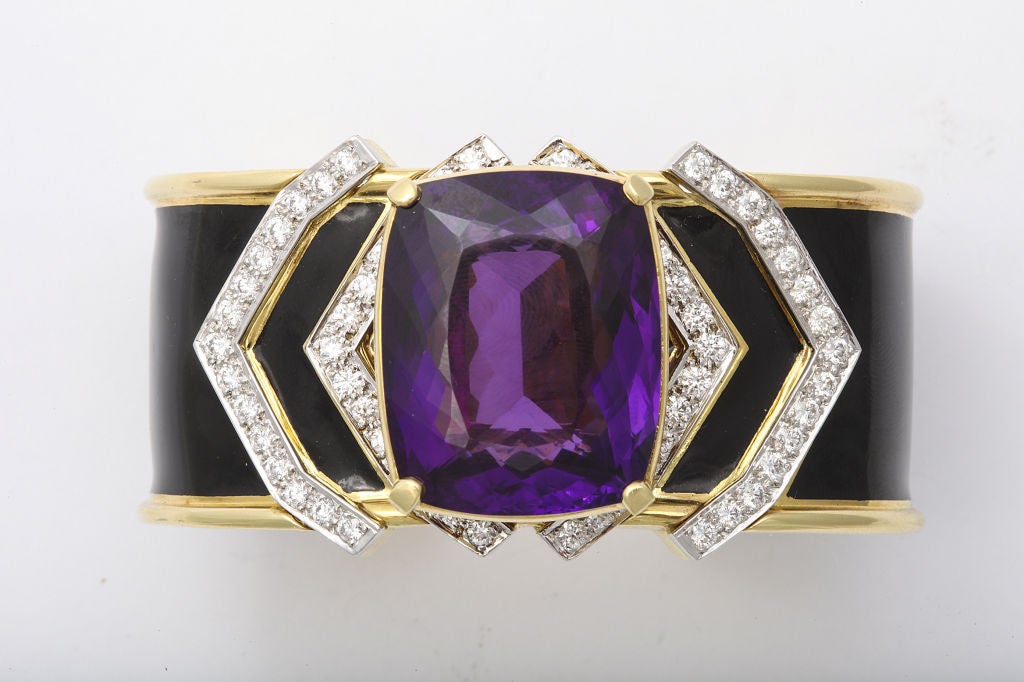 A stylish David Webb cuff bracelet.  Consisting of a large cushion cut amethyst  surrounded by diamonds. Mounted on 18 KT Gold, Platinum and black enamel. Signed DAVID WEBB 18K PT. Accompanied by certificate of authenticity.