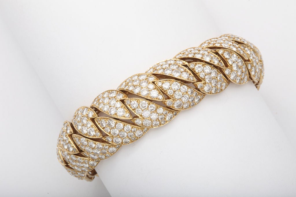 A  superb flexible diamond bracelet by Van Cleef & Arpels. Containing aprox 24 carats of diamonds. Signed and numbered.