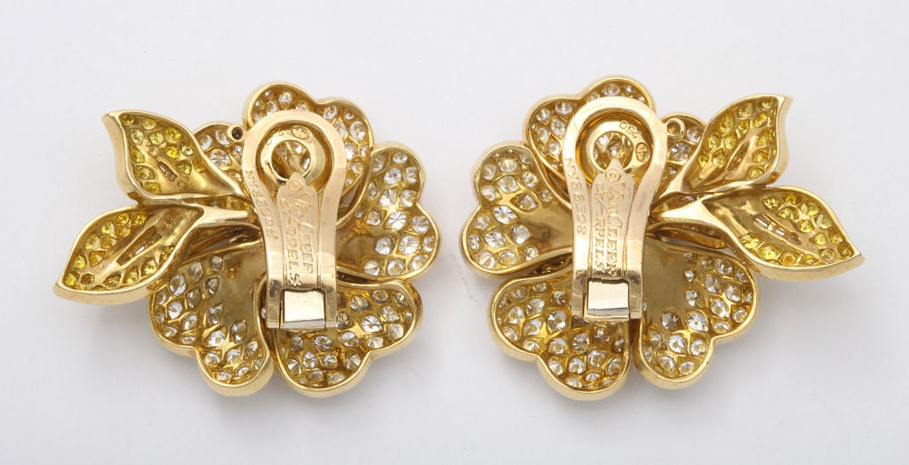A fine  pair of VanCleef & Arpels flower earrings, consisting of canary yellow and white diamonds. Signed Vancleef & Arpels NY numbered 66308. With Box.