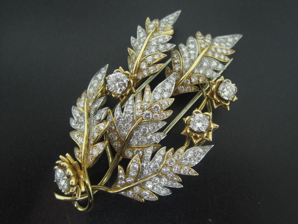 A superb brooch designed as a leaf consisting of apox 9 carats of diamonds. Signed Schlumberger and Tiffany with French Hallmarks.