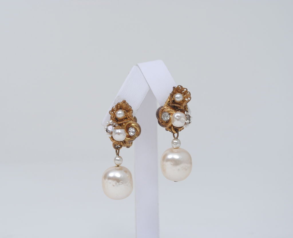 Miriam Haskell earrings w/ pearl drop and pear-shaped earpiece with pearls and rhinestones in different forms.