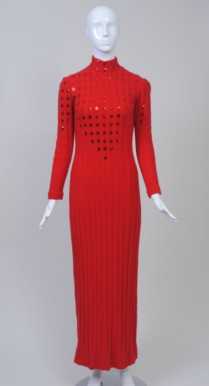 Ribbed wool knit sweater dress accented with red paillettes and red rhinestones in a diamond pattern on the bodice. Casual/dressy, so great for the holidays.