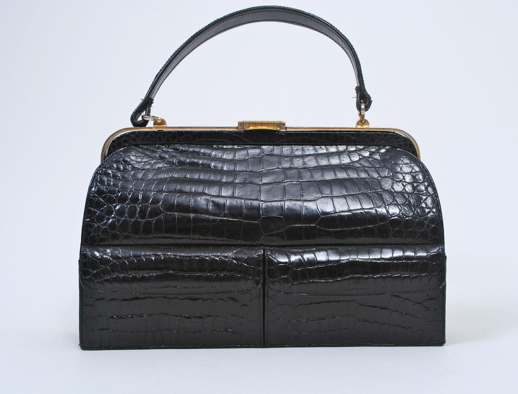 Own a classic! Lucille de Paris produced America's most sought-after skin bags during the 1950s and '60s, priding themselves on the quality of their skins and workmanship, as well as on their attention to detail. The distinguishing features of this