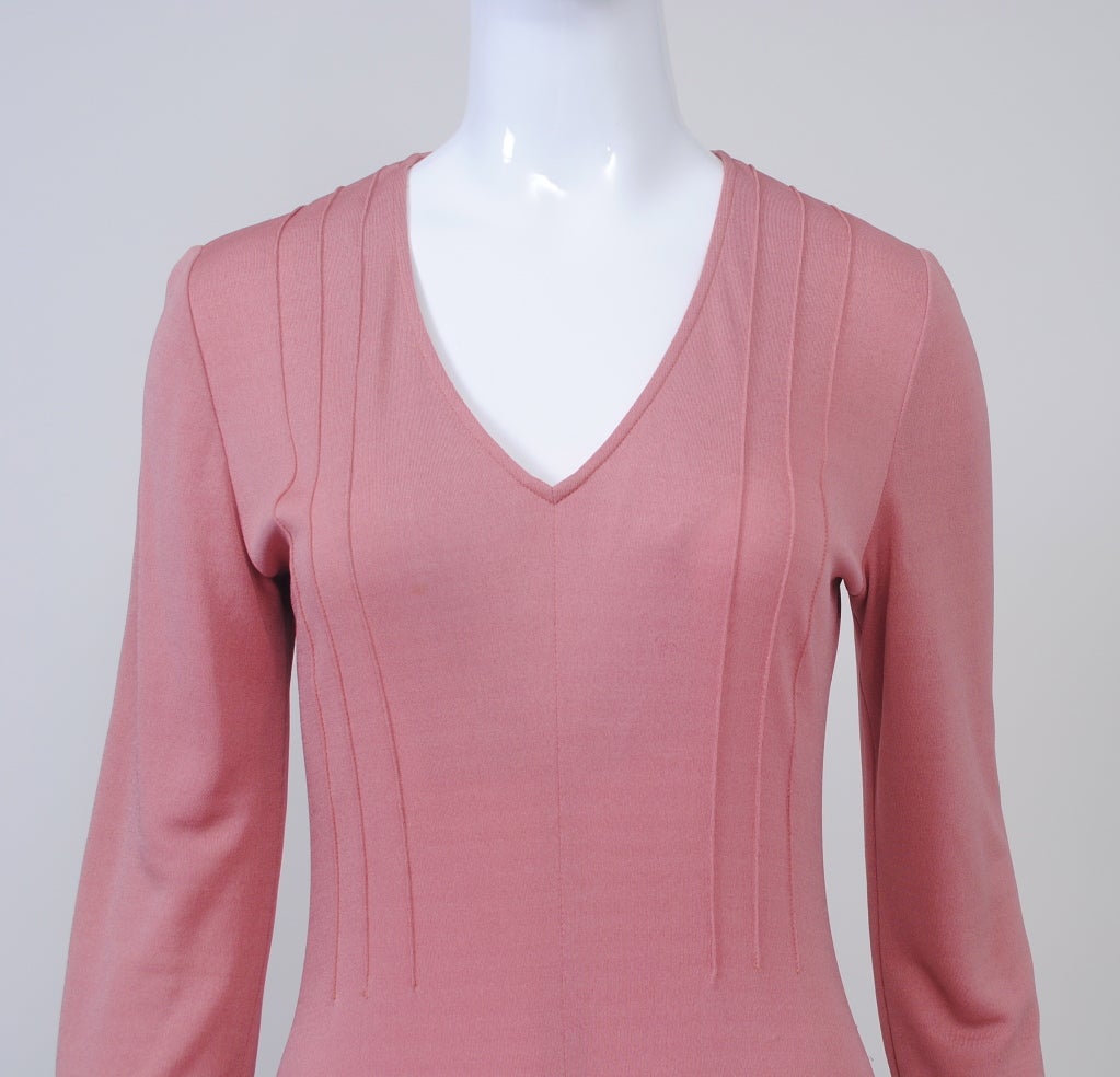 Joan Sibley and Dory Coffee, who established their eponymous firm in 1966, were known for their silk jersey body dresses. This version, in a beautiful shade of dusty pink, features a V-neck  bodice with tucking and bias-cut panels inserted into the