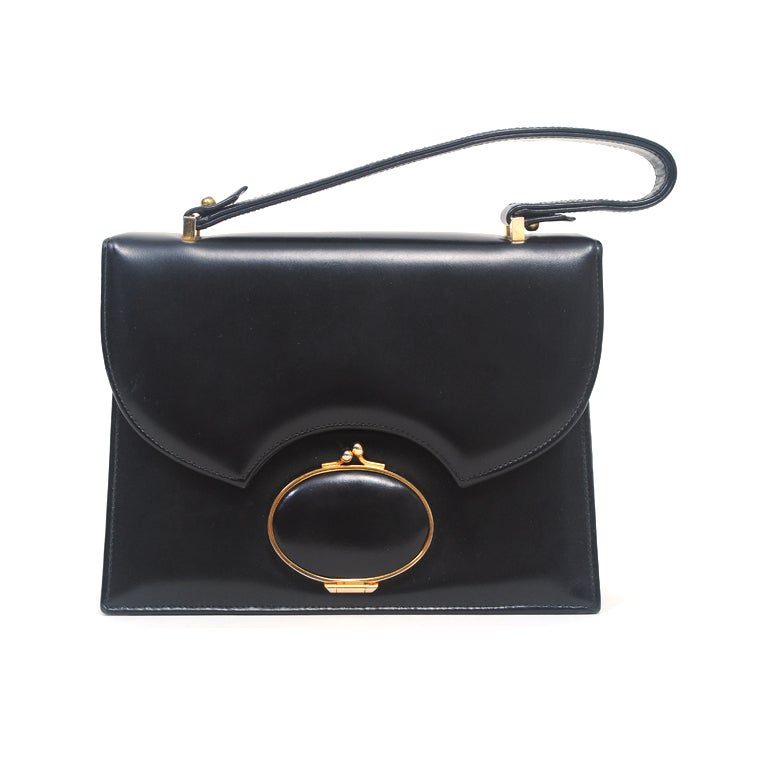 BLACK LEATHER 1960S HANDBAG WITH EXTERIOR MIRROR