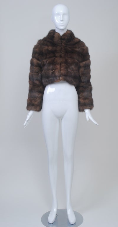 Luxury and chic combine in this Revillon bolero jacket of sumptuous Russian sable. Skins are worked vertically on body and sleeves and is close fitting throughout. Natural shoulder line continues up neck for integrated collar. Long narrow sleeves.