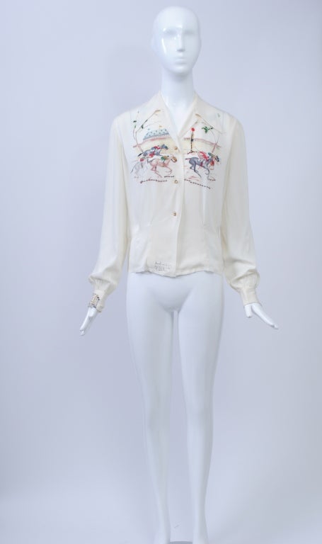 This vintage blouse is a prime example of the hand painted blouses that were created in California during the 1940s and '50s. The horse racing theme makes it even more special. The blouse features a shirt collar that can be worn open or closed at