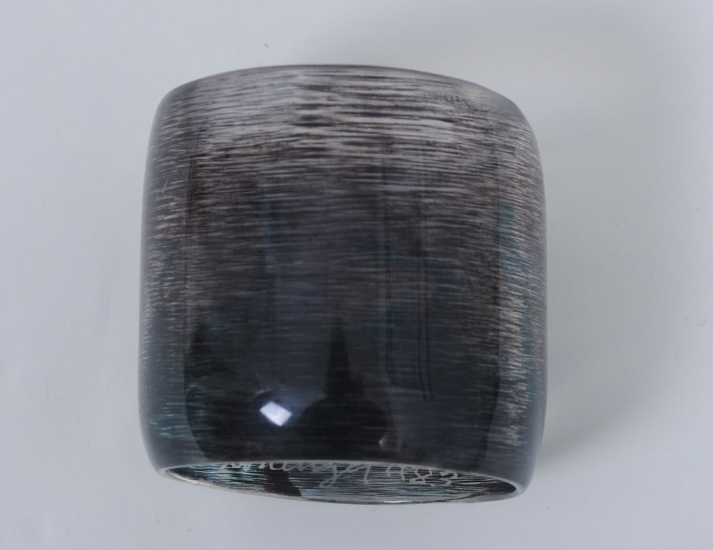 Cara Croninger,internationally acclaimed for her pioneering work in resin jewelry, has been creating unique pieces that are both wearable and collectible since 1972. This cuff is an excellent example of her work. Dating to 1983, and thus one of her