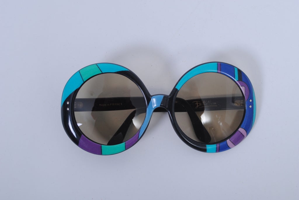 Iconic Pucci print oversized sunglasses. Round shape, pattern in blues, green and purple. Imprinted 