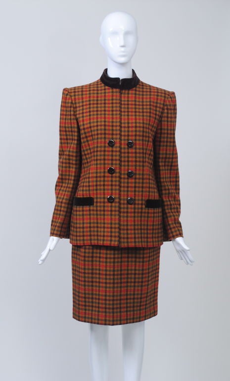 Valentino gold/orange plaid 1980s suit with brown velvet mandarin collar and pocket trim, slim above-the knee skirt, square padded shoulders. Double-breasted effect.