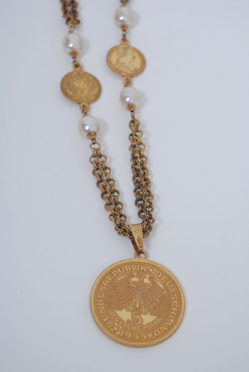 This Miriam Haskell chain necklace with large pendant coin is a classic. The large coin, a replica of a 1955 5 Deutsche Mark commemorative coin celebrating the 300th birthday of Ludwig Wilhelm of Baden, is suspended from a double strand chain