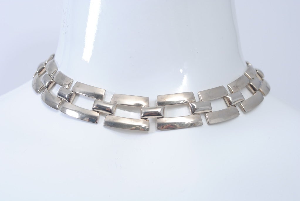 Sterling silver semi parure from the mid 20th century. Rectangular links encircle the nape of the neck and the wrist. Nice clean, modernist style. Stamped 