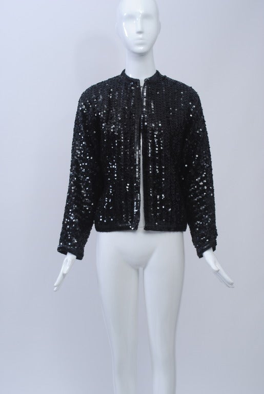 Giorgio Sant'Angelo baseball-style jacket in allover black sequins on a chiffon ground. Raglan sleeves, hook-and-eye front closures.