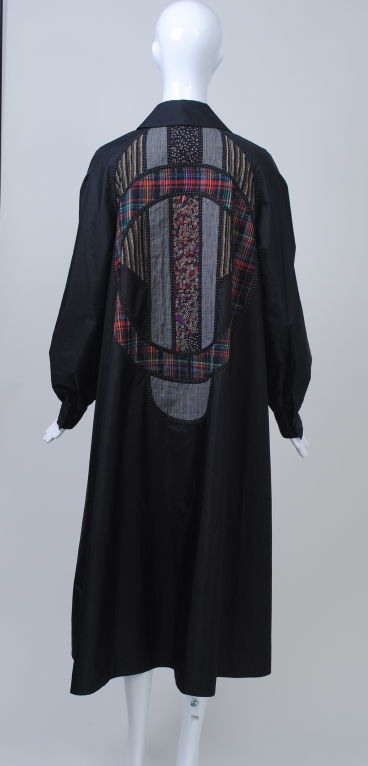 Koos van den Akker opened his first store in New York in 1970, where he introduced the collage-based designs that would become his trademark. This coat, a subdued example of Koos' work, is a classic single-breasted style in front and features