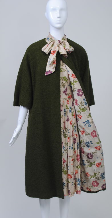 One of the doyennes of American female designers, Vera Maxwell began her own company in 1947. A favorite of hers during the 1950s and early '60s was the dress and coat ensemble, the coat solid and of simple shape lined in the print of the dress, of