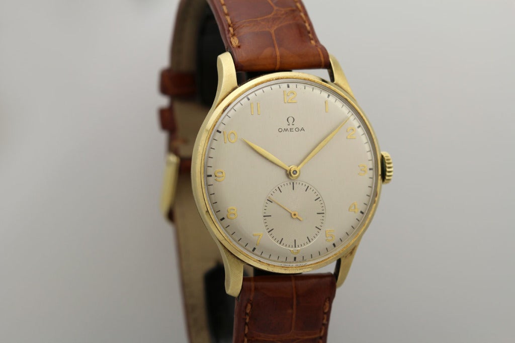 Omega Yellow Gold Oversized Wristwatch circa 1950s In Excellent Condition In Miami Beach, FL