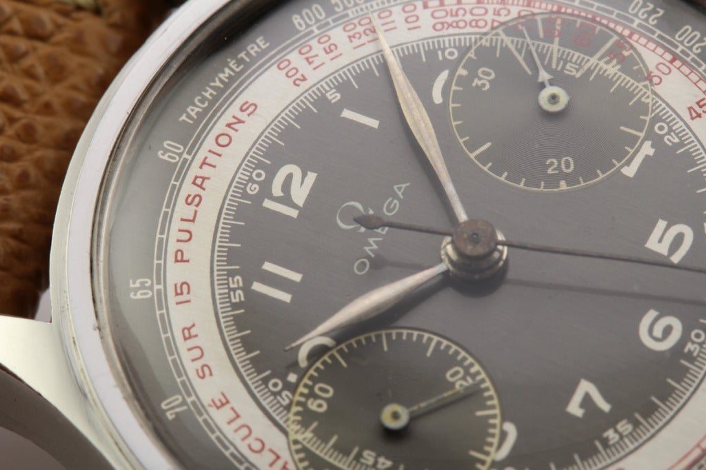 This is one of the best 1940s Omega chronographs that I have seen in a long time. It has an unpolished case with an original gray and white dial in impeccable condition. It has the most desired 33.3 Omega caliber movement. The case, dial, and