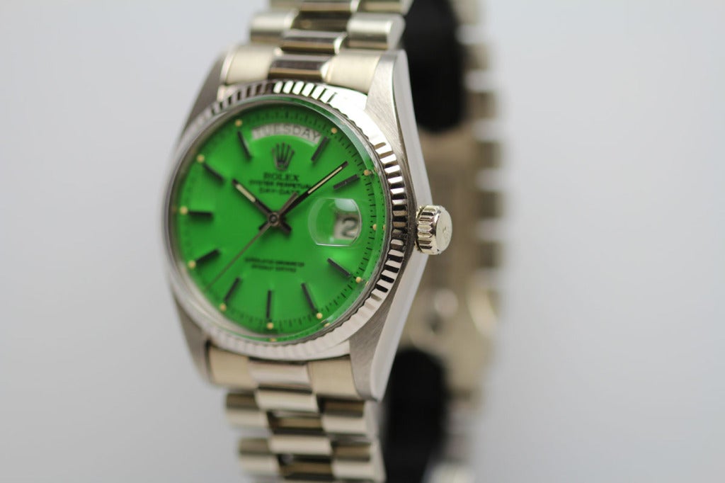 Rolex 18k white gold Day-Date President wristwatch, Ref. 1803, with an unusual green Stella dial, fluted bezel, on a President bracelet. 

This particular dial is called the Stella dial, and they are extremely rare and limited because Rolex did