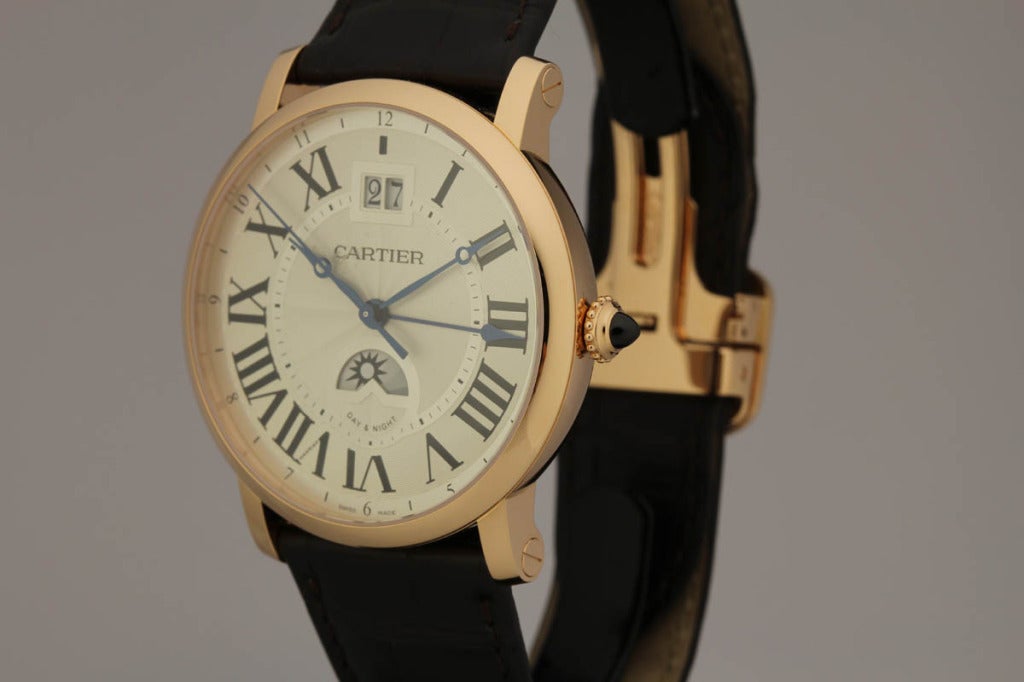 Cartier 18k rose gold Privee Rotonde XL wristwatch with date and dual time zone, Ref. W1556220. This watch is like new, the large 42mm case has an exhibition back showing the automatic movement. The silvered dial shows the time, seconds, second time