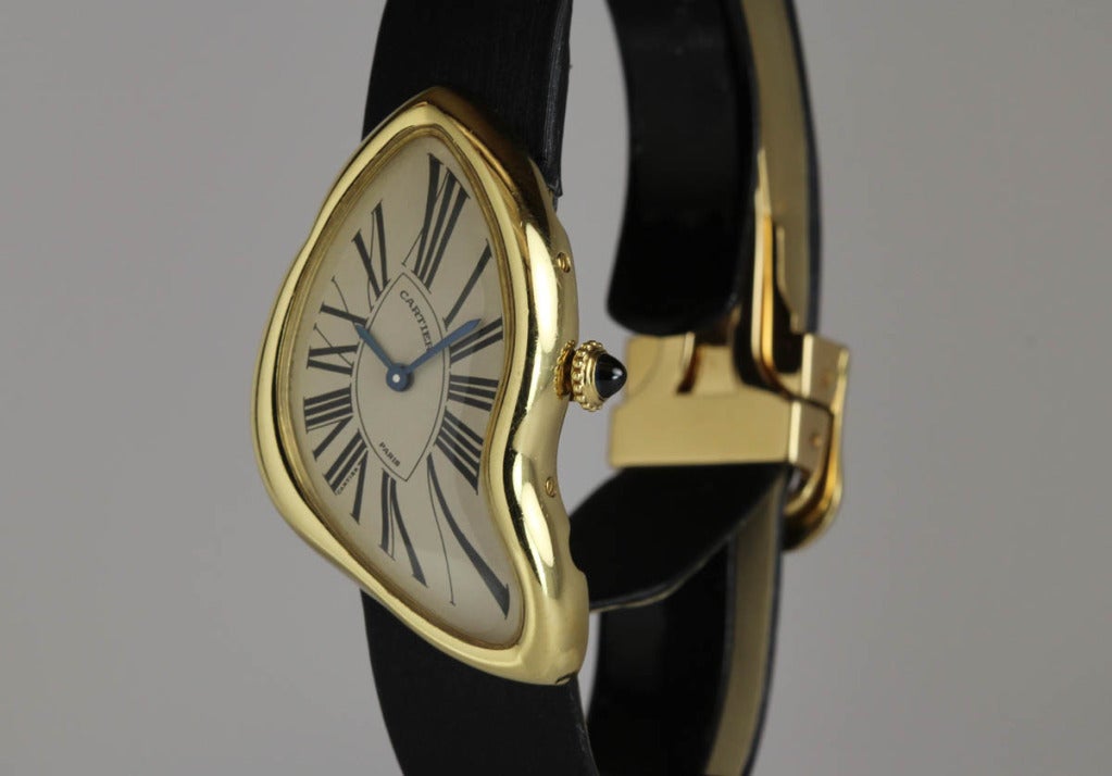 This Cartier Crash in 18k yellow gold is a limited edition of 400. The design is a reissue of the iconic Cartier Crash watch of the 1960s. There are a lot of stories surrounding this watch and its original beginnings. This watch is on a Cartier
