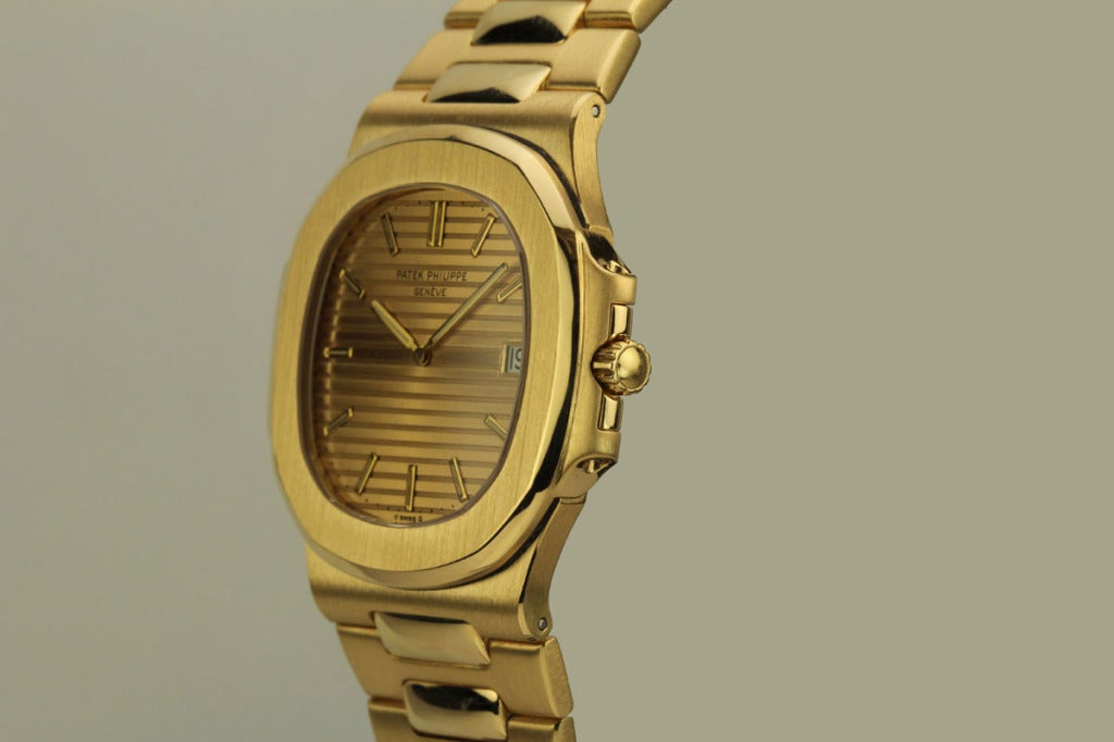 This is a mint example of the jumbo Patek Philippe Nautilus reference 3700 in 18k yellow gold from the 1970s. This is a very rare find especially in 18k yellow gold. It is a beautiful example with sharp edges and a mint and rare gold original dial.