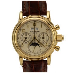 Patek Philippe Montre-bracelet chronographe en or jaune à calendrier perpétuel et seconde fendue Ref 5004J