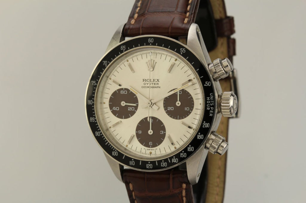 This is a beautiful example of a Rolex Daytona in stainless steel from the 1970s. The case is in mint condition with the original sticker on the back. The dial is incredible with beautiful 