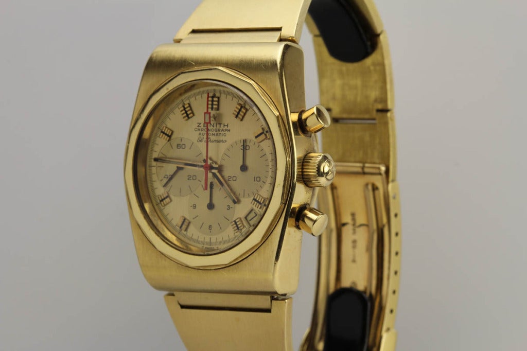 This is a rare 18k yellow gold Zenith El Primero chronograph wristwatch from the 1970s. This is an exceptional example that has never been polished with a mint condition dial. There were only about 100 examples of this model produced and they rarely