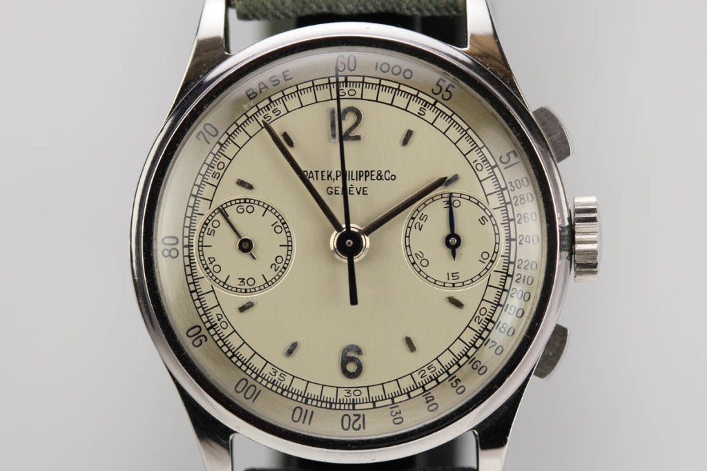 If you are looking for rare and perfection, this is it. 

This is an amazing and rare Patek Philippe Ref. 130 chronograph in stainless steel with an original mint two-tone dial. The dial has never been touched with the original lacquer finish. The