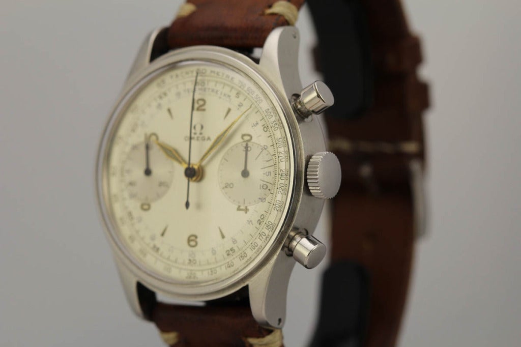 This is an exceptional example of a rare oversized stainless steel Omega chronograph wristwatch from the 1950s. Both the water resistant case and original dial are in mint condition. This is an Omega Ref. 2077 and it powered by one of Omega's best