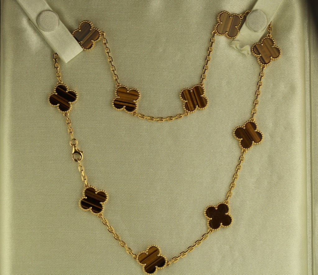 Van Cleef & Arpels vintage Alhambra, the classic clover motif of 10 tiger eye clovers each measures 15mm. Numbered, signed, and comes in a VCA necklace folder.
