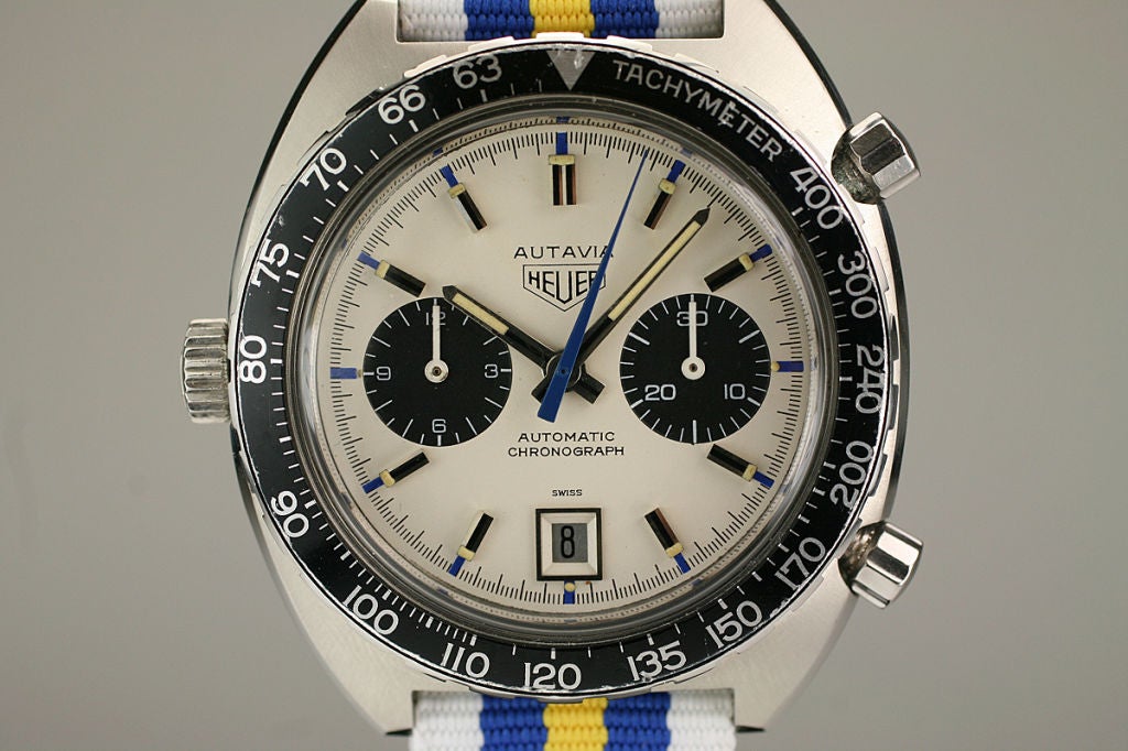 This is a Heuer Autavia automatic chronograph Jo Siffert version which is highly collectible. Typically the autavia models come with black dials but the Jo Siffert version comes with a white dial which is quite rare. It was worn and promoted by