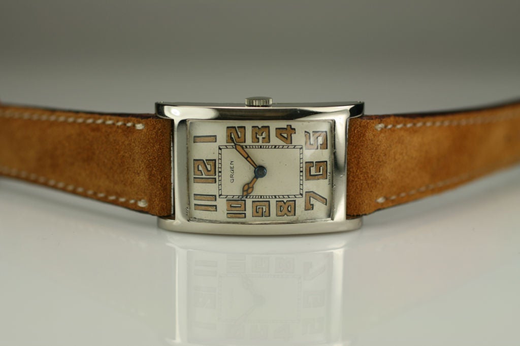 This is one of the most beautiful Gruen watches I have seen in sometime. It is a gold oversized rectangular watch from the 1920s. It has a beautiful original dial with luminescent figures. This oversized watch is extremely rare size for watches that