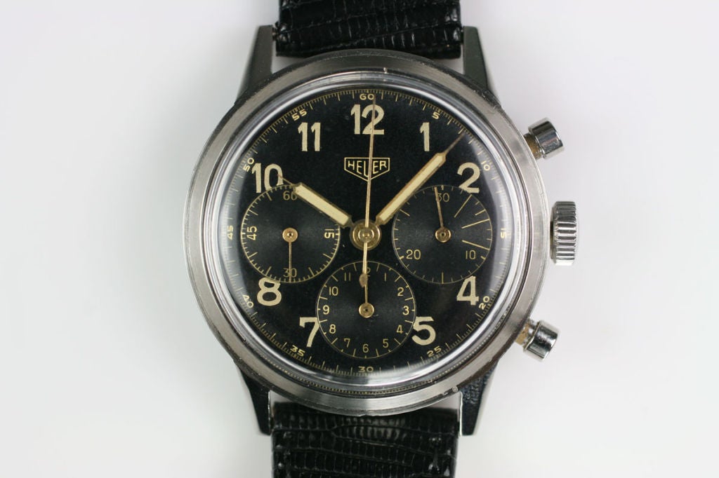 This is a beautiful original Heuer chronograph from the 1950s.  It is has a black original dial in excellent condition with beautiful luminescent Arabic markers.  It has a Valjoux movement which top quality for the time period and very collectible. 