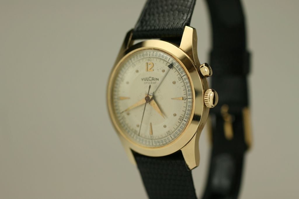 This is a manual wind alarm watch from the 1950s in 14k gold.  It has a beautiful original two-tone dial with pleasing patina.  This model is quite rare in solid 14k.  The sound of the alarm is great for a business trip.
